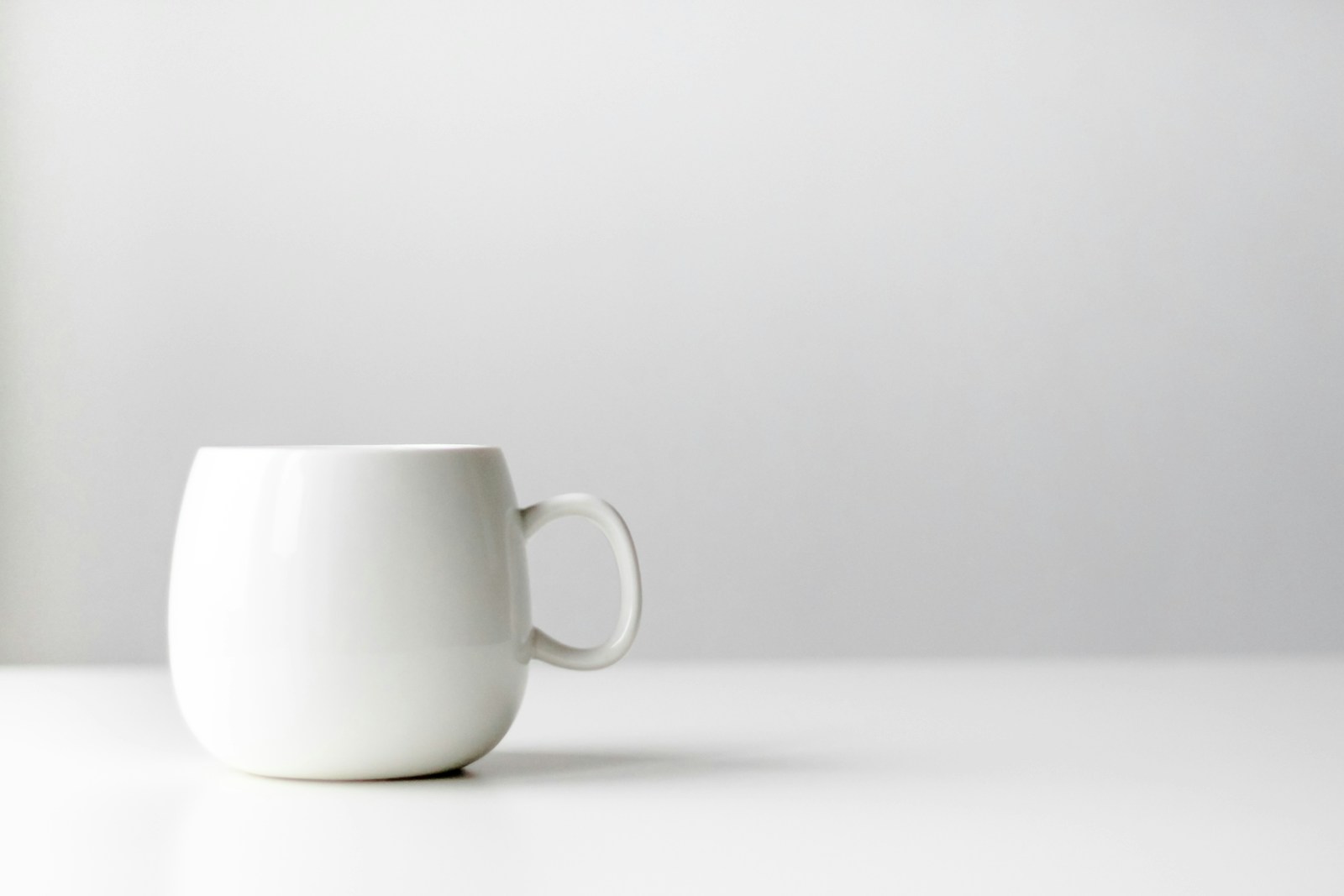 A white ceramic mug on a clean tabletop